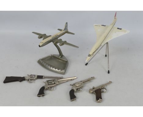 Victory - Redondo - A vintage chromed Vickers Viscount ashtray, a display model BA Concorde and 4 x cap guns, a Redondo Luger