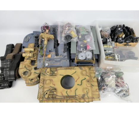 Heng Long - A collection of Battle Tank spare parts in 1:16 scale including bodies, tracks, motors, wheels and many other par