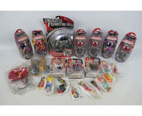 Transformers - Hasbro - Galoob. A selection of Ten boxed Transformers items from the Titanium, Universe and Automorph Technol