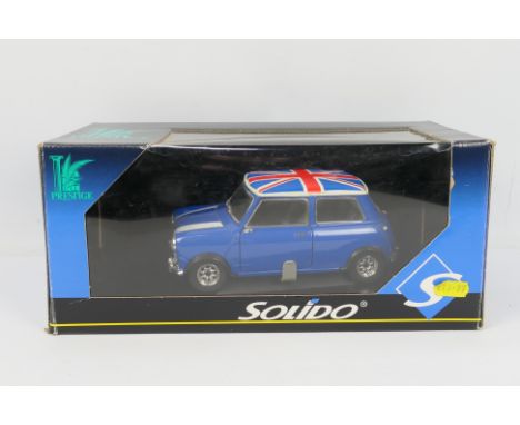 Solido - A boxed Solido Prestige Mini Cooper in 1:18 scale # 9734. The model is a little dusty from display and has one rear 