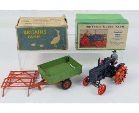 Britains - A boxed Fordson Major Tractor with spudded metal wheels # 127F and a boxed Two Wheel Tipping Trailer with rubber t