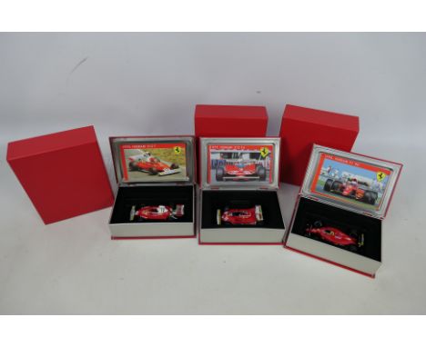 Hot Wheels - 3 x boxed Ferrari Grand Prix cars in 1:43 scale, a 1975 312T Monaco GP winner # SF04/75, a 1979 312 Monaco GP wi