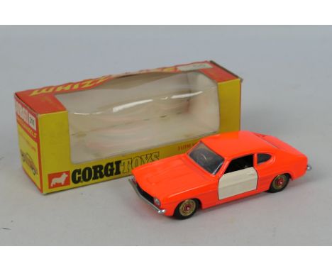 Corgi - A boxed Ford Capri 3.0 in fluorescent orange with red spot hubs # 311. The doors have been over painted in white, the