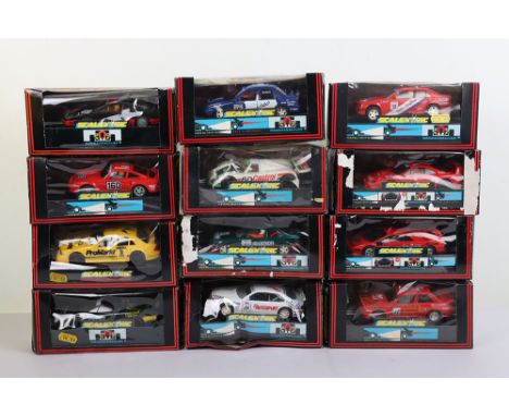 Twelve Scalextric Boxed cars Hornby. Including BMW, Porsche, Jaguar, Lamborghini, Mercedes, Ferrari and more. The boxes are i