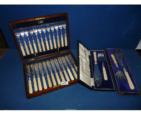 A wooden canteen of twelve fish knives and forks and two boxed fish serving knife and fork sets.