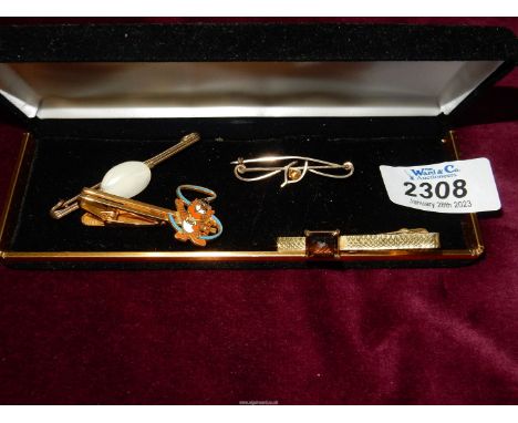 Two tie pins, plus two stick pin brooches one with white stone, the other gold coloured wishbone.