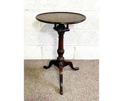 A George III mahogany snap top wine table, 18th century, the circular top with birdcage mount and turned pillar with tripod l