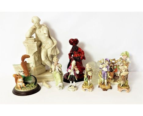 An assortment of decorative ceramic figures, including a Royal Doulton Flambé figure of The Lamp Seller, and similar (a lot)
