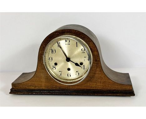 A group of assorted items including a vintage mantel clock; a modern table sculpture of a figure within a pine block and work