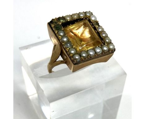 A 19th century pearl and quartz gentleman’s ring, with unmarked yellow metal setting, ring size P, square topped, with band o