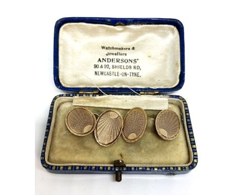 A pair of 9 carat gold oval cuff links, with engine turned decoration, 6g