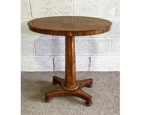 A small Victorian mahogany oval occasional table, circa 1870, with fixed plain oval top on a tapered fluted pillar and quatre