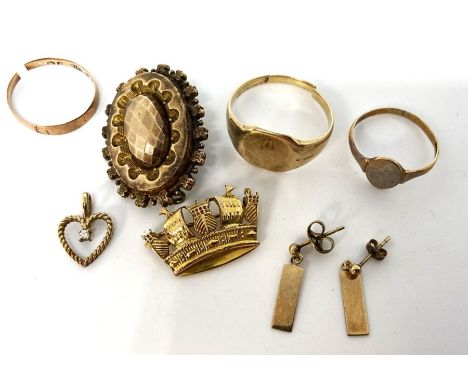 A small quantity of gold and costume jewellery, including a 9 carat gold ring, 5g; two more rings, hallmarked 9 carat, 2g; a 