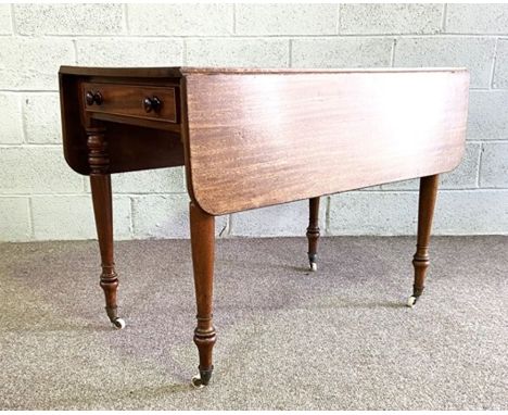 A mahogany Pembroke table, late 19th century, with a rounded drop leaf top, a single end drawer and set on turned tapered leg