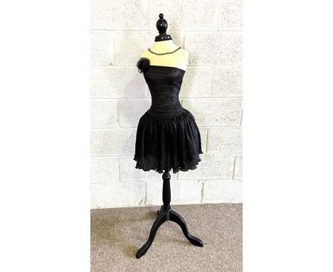 A useful dressmakers mannequin, on an ebonized tripod stand, including a Vintage little black dress&nbsp;