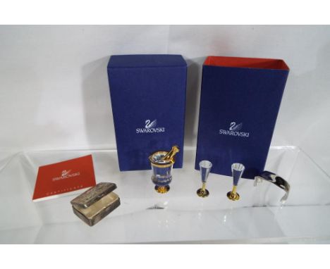 Swarovski - a champagne set comprising miniature bottle, bucket, two flutes and white metal towel in original box - also incl