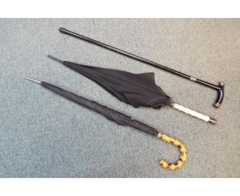 A bone handled umbrella with hallmarked silver mounts, a further umbrella with cane handle and an ebony walking stick hallmar
