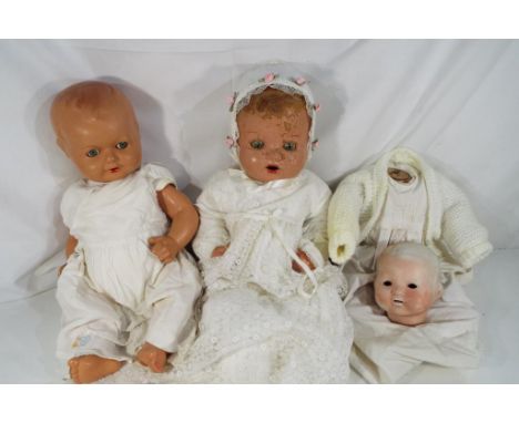 Dolls - a ceramic dressed doll with moulded jointed limbs, sleeping eyes and open mouth, marked to the back of the neck Made 