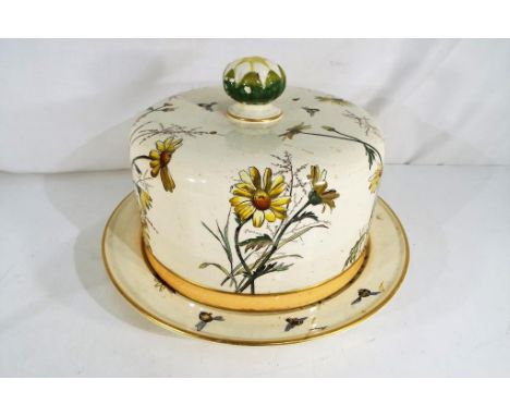 A George Jones and Sons ceramic cheese dish and cover decorated with flowers and bees, impressed marks to the base, approx 22