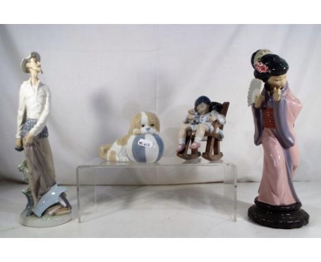 Lladro - Three ceramic figurines comprising # 5448 'Naptime', # 4854 'Quixote Standing Up' (lacking sword blade), # 4990 'Gei