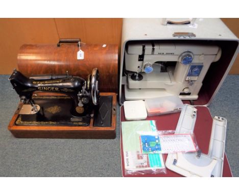 A vintage Singer sewing machine in a wooden case and a cased Janome model 613 sewing machine (2).