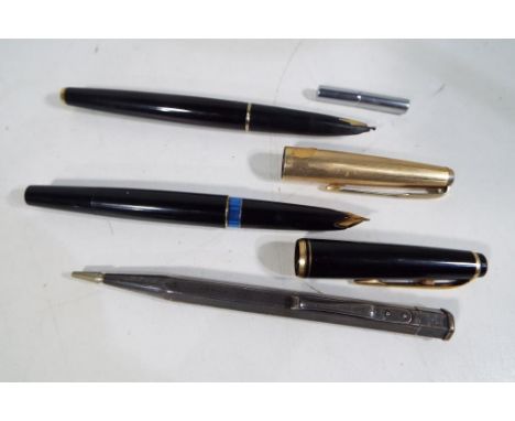 A silver hallmarked propelling pencil by JM &amp; Co,  a Parker fountain pen and one further fountain pen and a white metal l