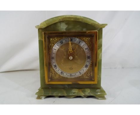 A green onyx cased mantel clock with gilt face, Roman numerals to a silvered chapter ring marked Elliott Est £20 - £40