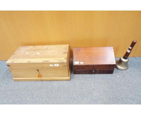 A lot to include a wooden storage chest approx 22 x 50 x 26 cms, a wooden drawing box and a vintage bell (3)