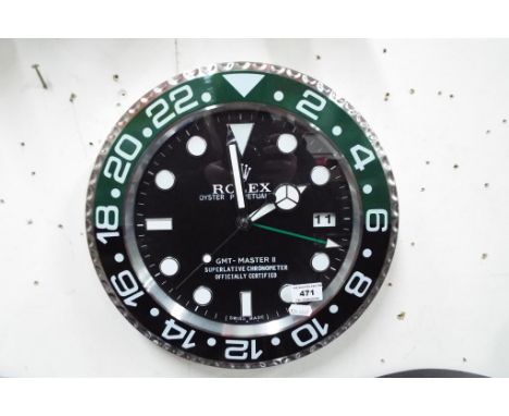 A advertising wall clock, Est £80 - £120