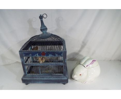 A wood and metal bird cage with two imitation birds along with a ceramic biscuit barrel in the form of a rabbit (2)