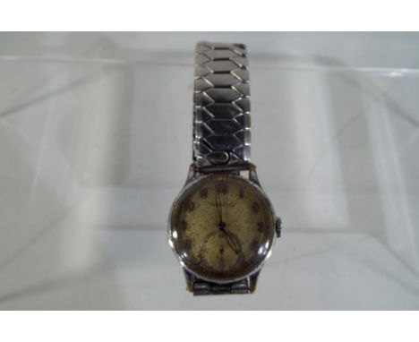 A Jaeger LeCoultre gentleman's wristwatch, Arabic numerals, subsidiary seconds dial, reverse marked 393002 with Excalibur exp