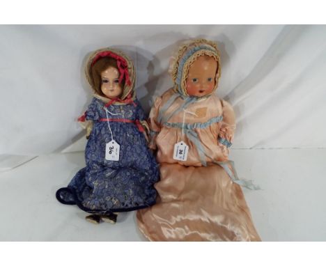 A cabinet sized doll with ceramic head, open mouth, hand painted detailing with impressed kite mark to the  back of the neck,