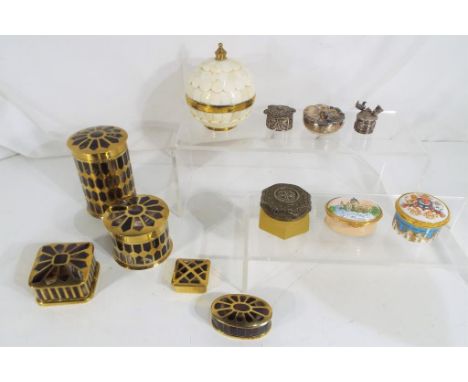 A collection of trinket boxes to include enamelled examples, filigree white metal and similar.