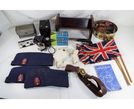 A mixed lot to include vintage cameras, hand tools, flags, a cigarette lighter in the form of a hand gun and a wall mahogany 