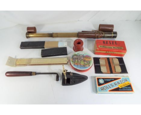 A mixed lot of collectables to include brass telescope, Huntley and Palmers biscuit tin, Pretty Well Bakelite inkwell, slide 