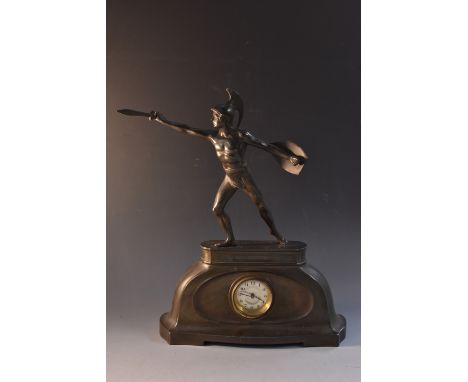 A French Art Deco pewter mantel clock, the domed case surmounted with a spelter Roman gladiator figure, circular dial, Arabic
