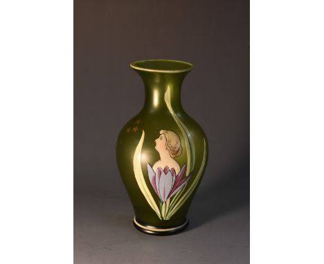 An Art Nouveau miniature baluster shaped glass vase, hand enamelled with the portrait bust of a beauty amongst lily petals an