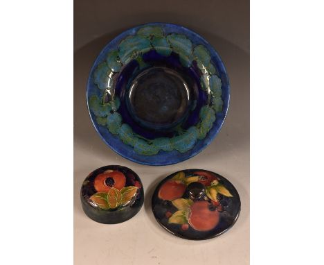 A Moorcroft Moonlite Blue pattern flared cylindrical bowl, tube lined with trees, in mottled blue on a cobalt ground, 25cm di
