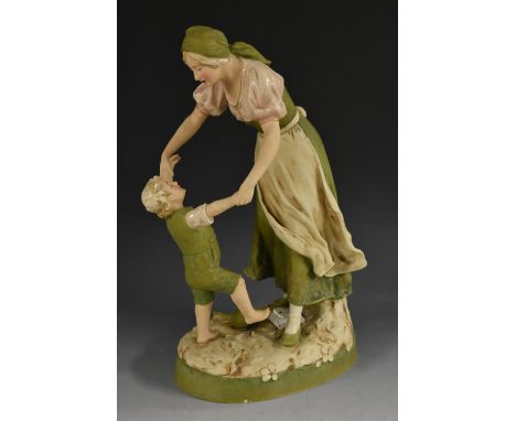 A Royal Dux model, mother and child,  playing, oval base, picked out in green, pink and gilt, 38cm high, pink triangle mark, 