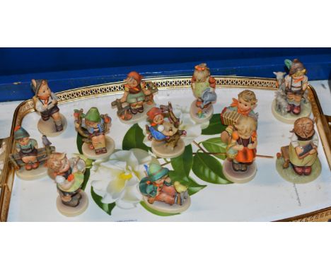 12 VARIOUS HUMMEL FIGURINE ORNAMENTS     