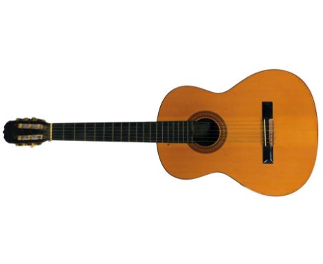 A Hohner acoustic guitar, model number HC-06. 