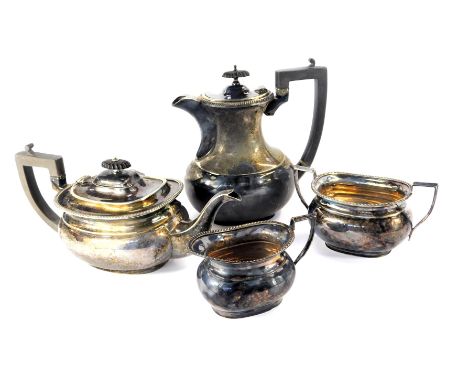 A four piece silver plated tea set, of swollen rectangular form, with gadrooned borders, comprising teapot, hot water jug, su