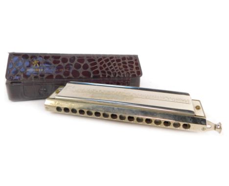 An M Hohner 64 chromonica, in simulated crocodile case. 
