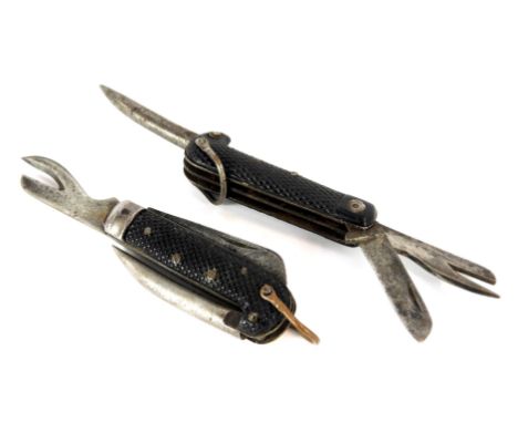 Two WWII British Army jack knives, one with tin opener blade stamped and dated 1943 W&amp;SB Sheffield, the other stamped (?)