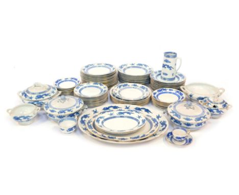 A Booths ironstone and other harlequin dinner service, each piece decorated with Oriental dragons against a white ground with