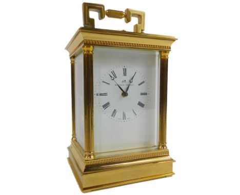 A 20thC brass carriage clock, the square enamel dial bearing Roman numerals for Matthew Norman, eleven jewel unadjusted Swiss