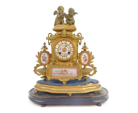 A 19thC French gilt metal mantel clock, the circular enamel dial bearing Roman numerals and decorated with flowers, eight day