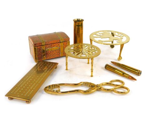 A group of brassware, to include trivet, cribbage board, tea canister modelled as a chest, shell cases, etc. 