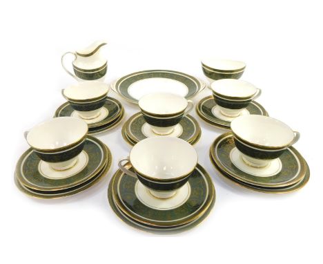 A Royal Doulton porcelain part tea service decorated in the Vanborough pattern, comprising six teacups and saucers, six side 