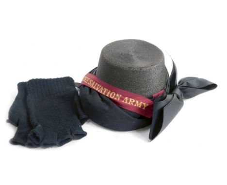 An early 20thC Salvation Army bonnet, with burgundy Salvation Army band and large bow, boxed, together with a pair of black w